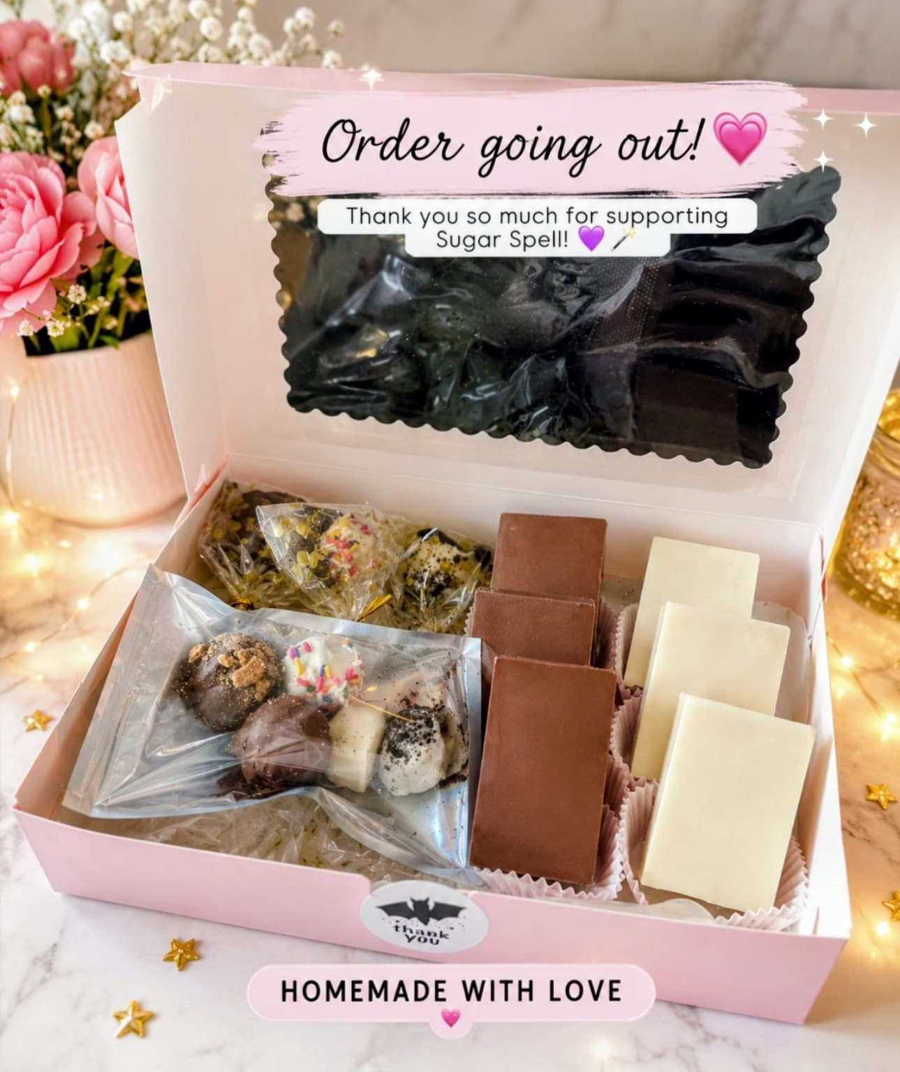Open gift box filled with an assortment of Sugar Spell treats