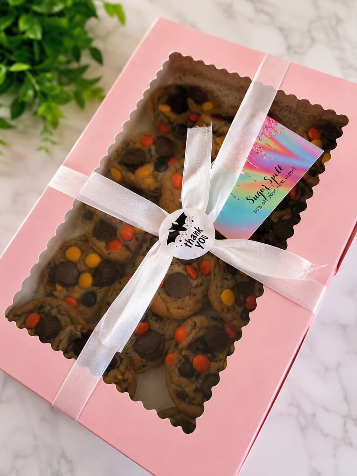 Ribbon-tied box of loaded Reese's Pieces cookies